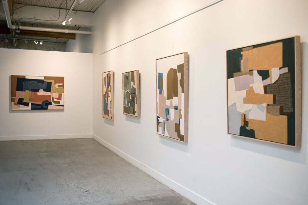 Rubeena Ratcliffe paintings hung on the wall at seattle art source